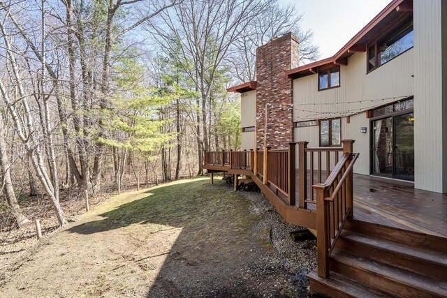 view of yard featuring a wooden deck