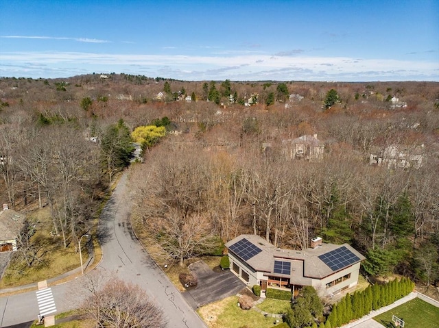 aerial view featuring a wooded view