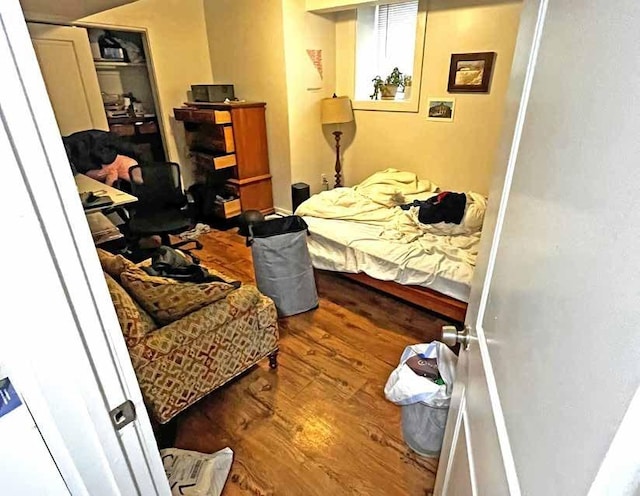 bedroom featuring wood finished floors