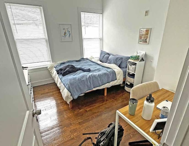 bedroom featuring wood finished floors