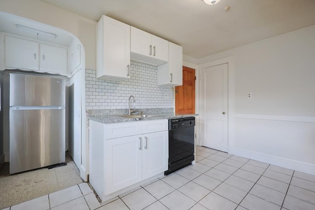 18-20 Melbourne Ave, Newton, MA 02460 - kitchen featuring freestanding refrigerator, black dishwasher, backsplash, white cabinetry, and light stone countertops