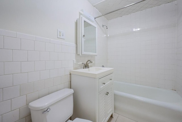 18-20 Melbourne Ave, Newton, MA 02460 - full bath with tile walls, vanity, shower / bath combination, tile patterned flooring, and a wainscoted wall