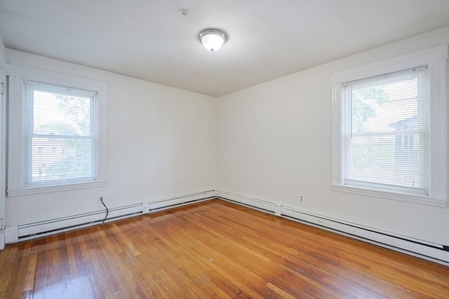 18-20 Melbourne Ave, Newton, MA 02460 - unfurnished room with healthy amount of natural light and wood finished floors
