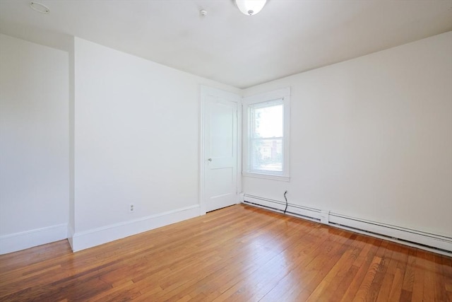 18-20 Melbourne Ave, Newton, MA 02460 - spare room with a baseboard radiator and light wood-style floors