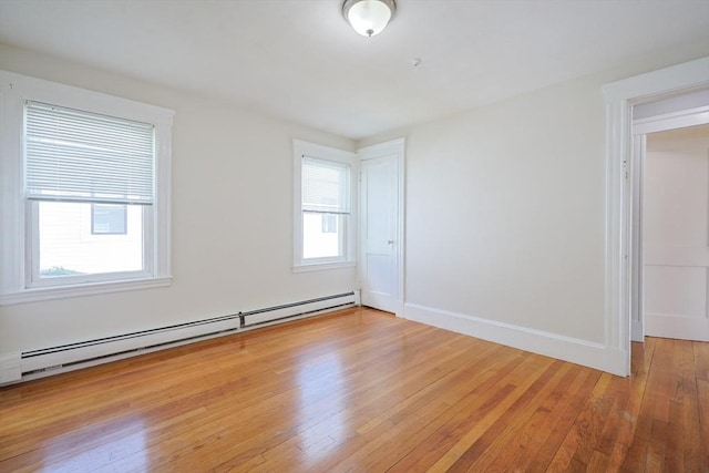 18-20 Melbourne Ave, Newton, MA 02460 - unfurnished room with a baseboard radiator and light wood-style floors