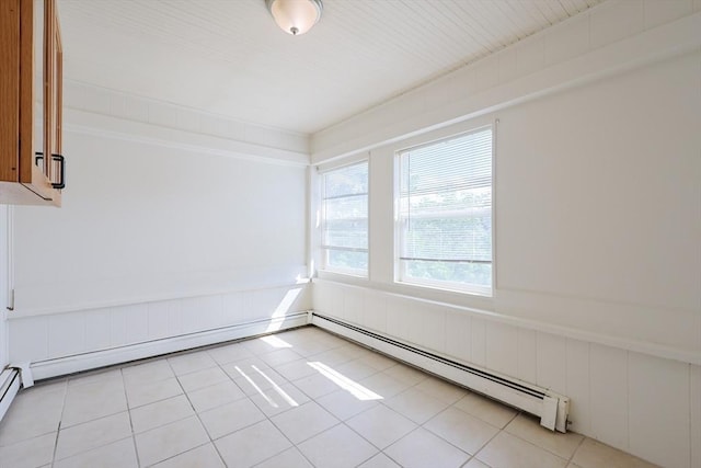 18-20 Melbourne Ave, Newton, MA 02460 - spare room featuring a baseboard heating unit, wainscoting, and light tile patterned floors