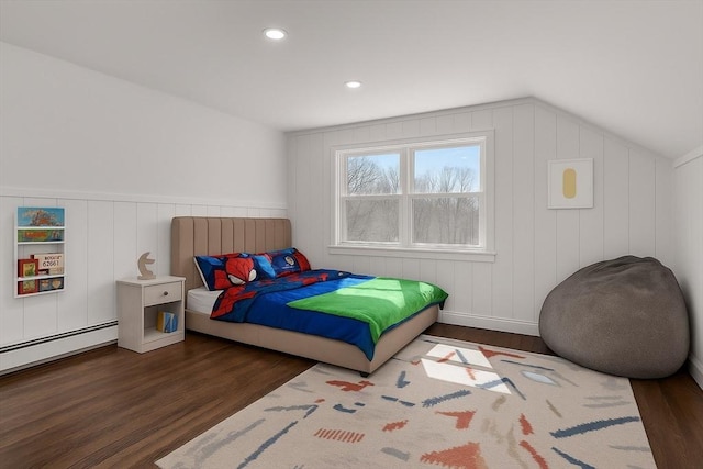 61 Greenwood Ave, Stoughton, MA 02072 - bedroom with wood finished floors, vaulted ceiling, recessed lighting, a decorative wall, and a baseboard radiator
