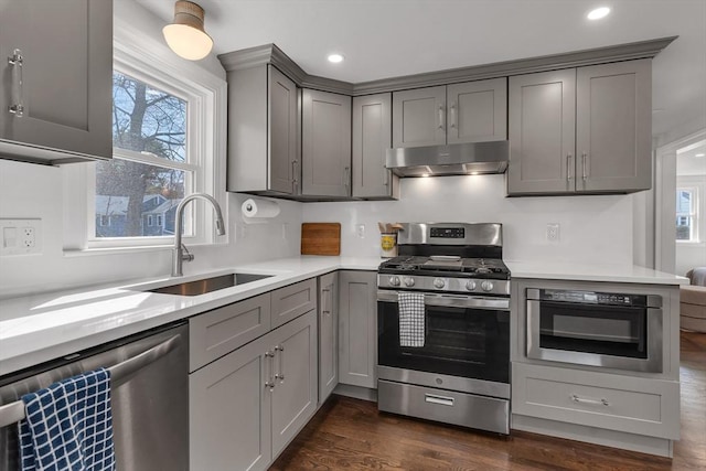61 Greenwood Ave, Stoughton, MA 02072 - kitchen with stainless steel appliances, gray cabinets, a sink, under cabinet range hood, and recessed lighting