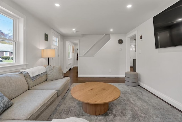 61 Greenwood Ave, Stoughton, MA 02072 - living area featuring wood finished floors, recessed lighting, baseboards, healthy amount of natural light, and stairs