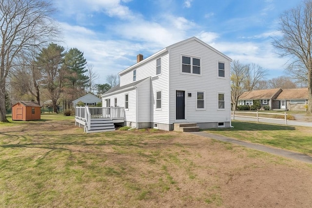 61 Greenwood Ave, Stoughton, MA 02072 - view of front of house with a front yard, a chimney, a deck, and entry steps
