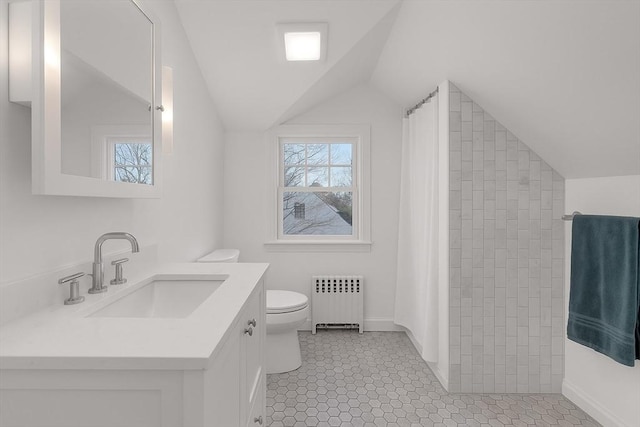 61 Greenwood Ave, Stoughton, MA 02072 - full bath with radiator heating unit, vaulted ceiling, toilet, tiled shower, and plenty of natural light