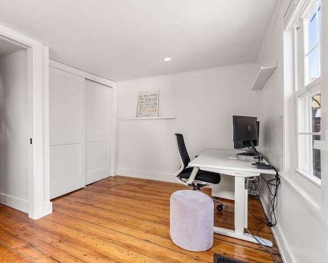 home office featuring baseboards, recessed lighting, light wood-style flooring, and a healthy amount of sunlight