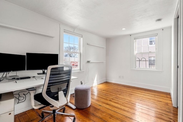 office space with hardwood / wood-style flooring and baseboards