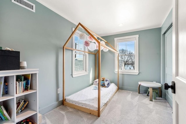 bedroom featuring carpet, visible vents, and baseboards