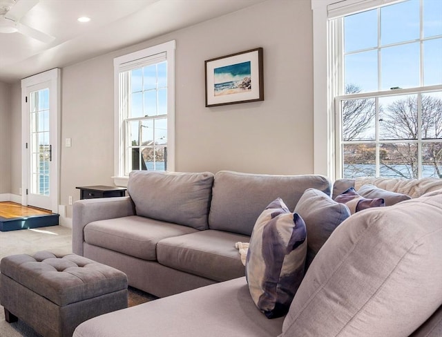 living area featuring carpet floors, recessed lighting, ceiling fan, and baseboards