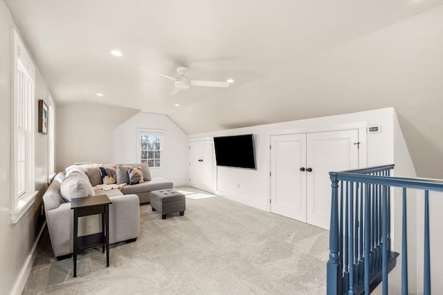 carpeted living area with recessed lighting, vaulted ceiling, baseboards, and ceiling fan