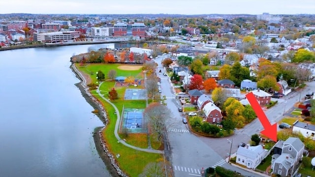 birds eye view of property featuring a water view