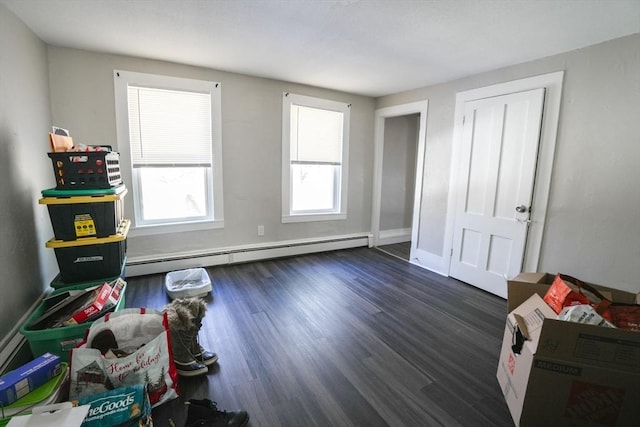 interior space with wood finished floors, baseboards, and baseboard heating