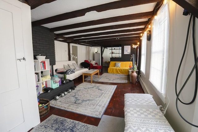 bedroom with beamed ceiling and hardwood / wood-style flooring