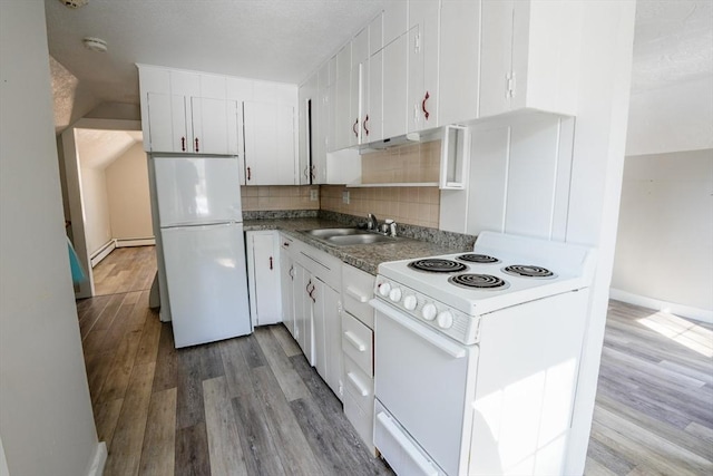 kitchen with backsplash, wood finished floors, white appliances, white cabinetry, and a sink