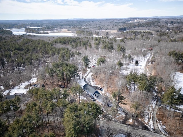 birds eye view of property with a wooded view