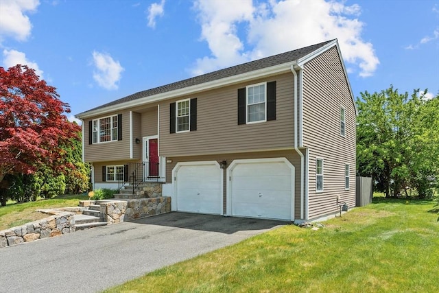447 Old Connecticut Path, Framingham, MA 01701 - raised ranch with an attached garage, asphalt driveway, and a front yard