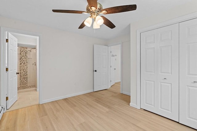 447 Old Connecticut Path, Framingham, MA 01701 - unfurnished bedroom featuring a closet, light wood finished floors, ensuite bath, baseboards, and a ceiling fan