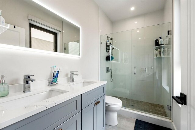 388 Athens St Unit 1, Boston, MA 02127 - full bath with toilet, a shower stall, double vanity, and recessed lighting