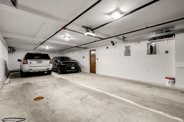 388 Athens St Unit 1, Boston, MA 02127 - garage with a garage door opener and electric panel