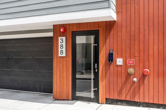 388 Athens St Unit 1, Boston, MA 02127 - doorway to property featuring a garage