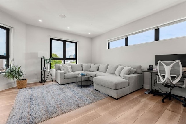 388 Athens St Unit 1, Boston, MA 02127 - living room with light wood-style floors, recessed lighting, and an office area