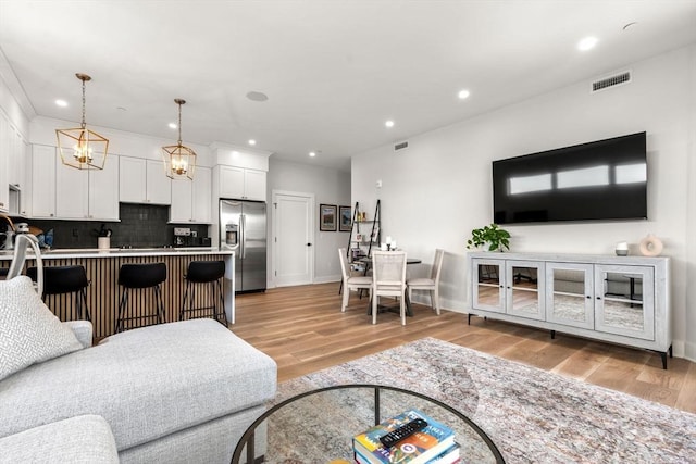 388 Athens St Unit 1, Boston, MA 02127 - living room featuring recessed lighting, light wood finished floors, and baseboards