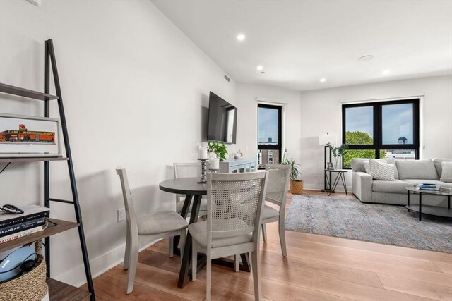 388 Athens St Unit 1, Boston, MA 02127 - dining area with light wood-style flooring, recessed lighting, and baseboards