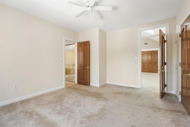 empty room featuring baseboards, ceiling fan, and light colored carpet