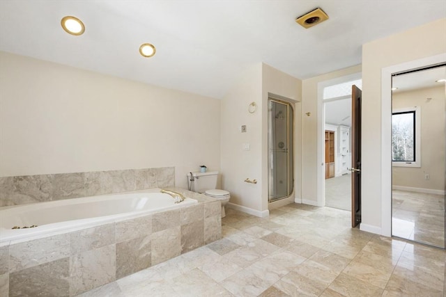 full bathroom with toilet, a garden tub, baseboards, and a stall shower