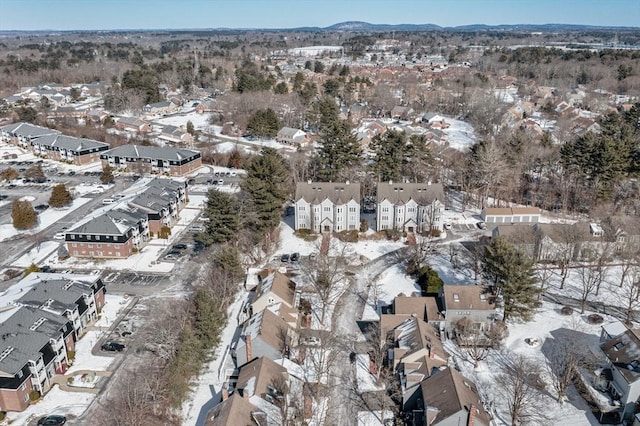 snowy aerial view featuring a residential view