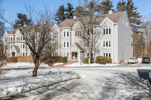 snow covered building with a residential view