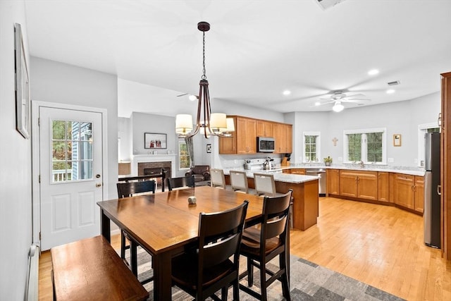 7 Hemlock, Kingston, MA 02364 - dining space with ceiling fan, recessed lighting, plenty of natural light, and a fireplace