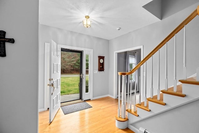 7 Hemlock, Kingston, MA 02364 - foyer entrance with baseboards, wood finished floors, and stairs