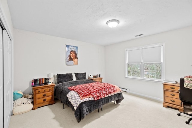 7 Hemlock, Kingston, MA 02364 - bedroom with a closet, baseboards, carpet flooring, visible vents, and a baseboard radiator