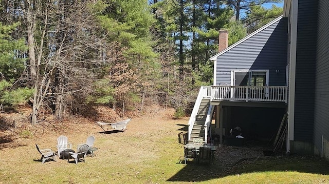 7 Hemlock, Kingston, MA 02364 - view of yard featuring stairway, a deck, and an outdoor fire pit
