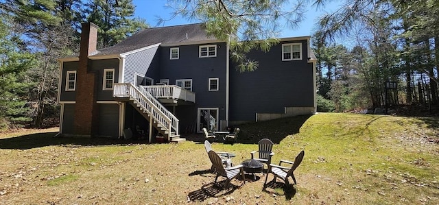 7 Hemlock, Kingston, MA 02364 - rear view of house featuring a chimney, stairway, an outdoor fire pit, a deck, and a lawn