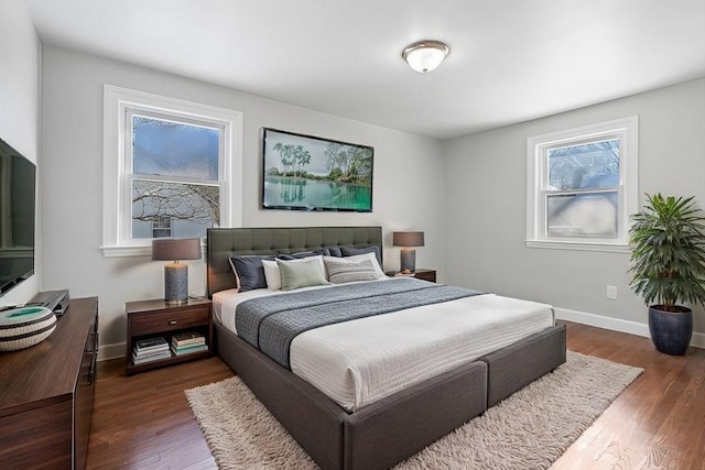 bedroom featuring dark hardwood / wood-style flooring