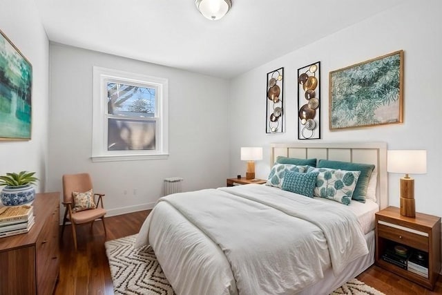 bedroom featuring dark hardwood / wood-style flooring