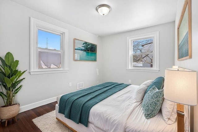 bedroom featuring dark hardwood / wood-style floors