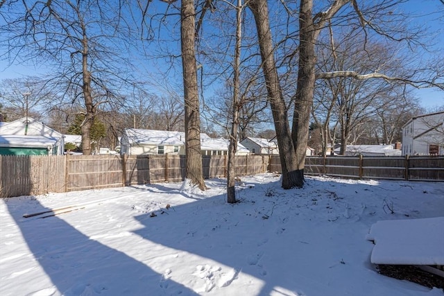 view of yard layered in snow