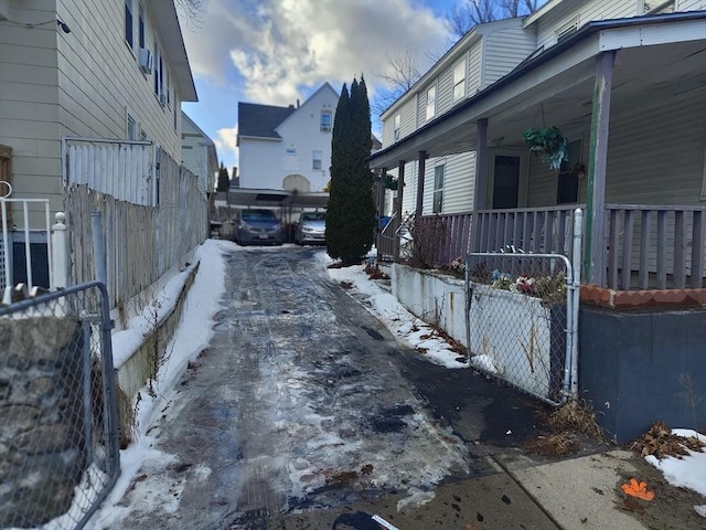 view of snow covered exterior with covered porch