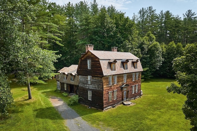 view of home's exterior featuring a yard