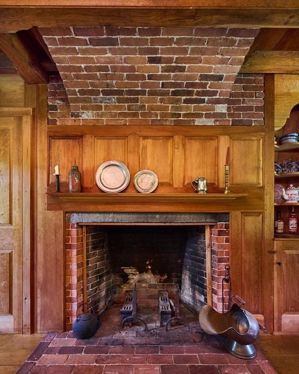 room details with a fireplace and wooden walls