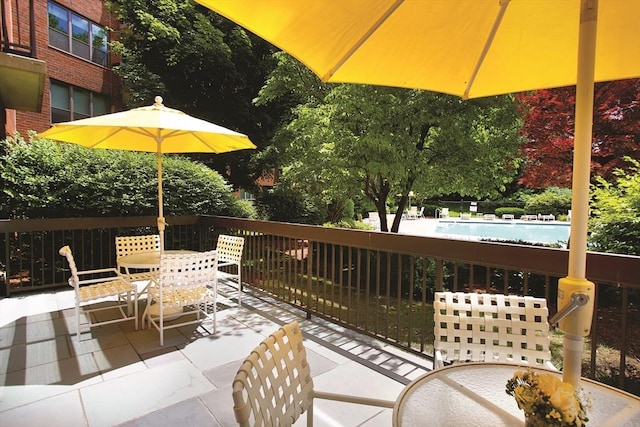 210 Nahanton St Unit 504, Newton, MA 02459 - view of patio / terrace with outdoor dining area and a community pool